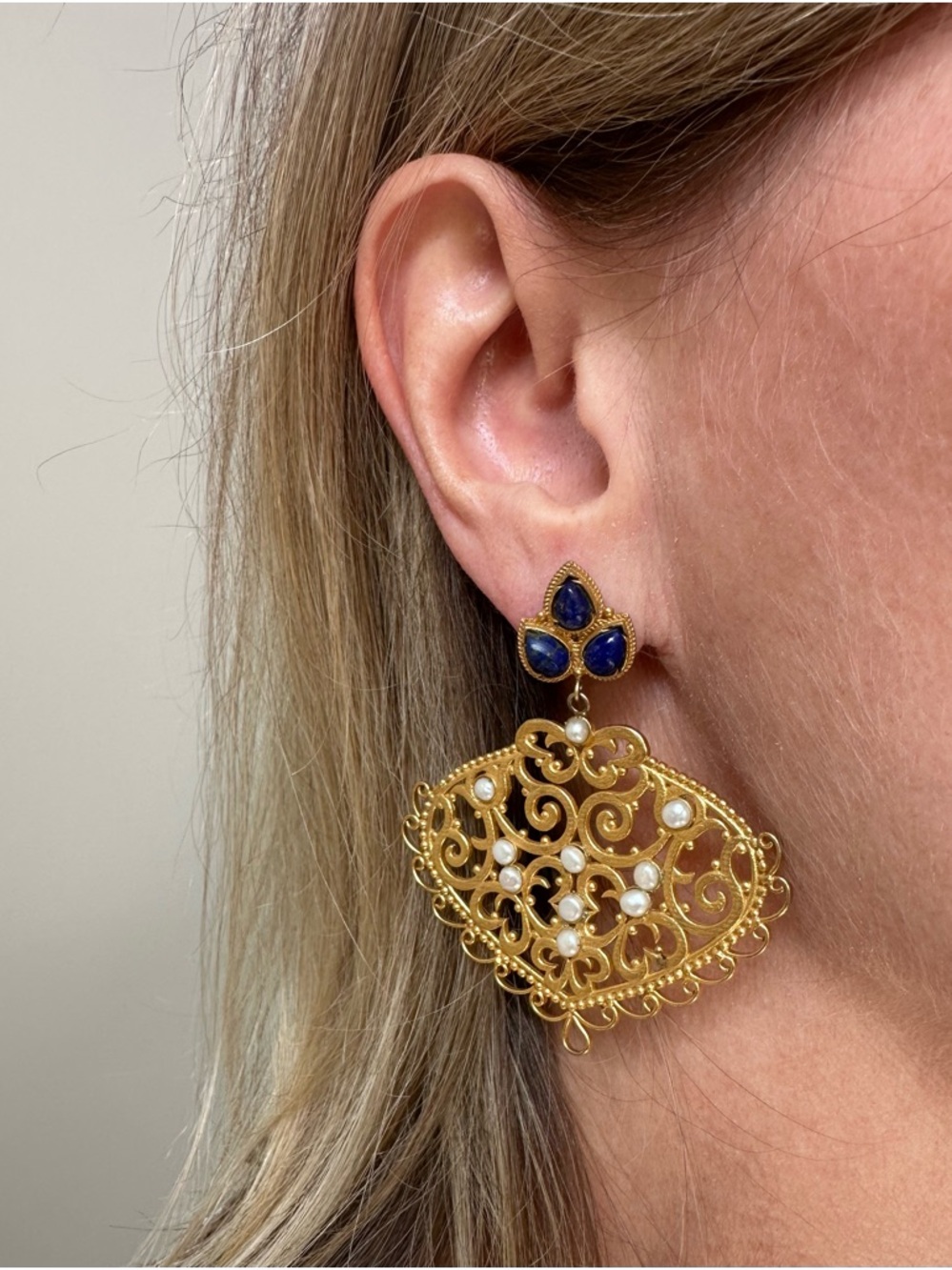 Gold tone filigree dangle earrings with lapis and seed pearls